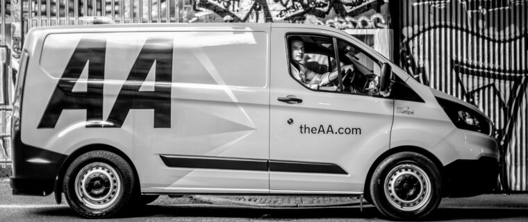 a man sitting on driving seat in van