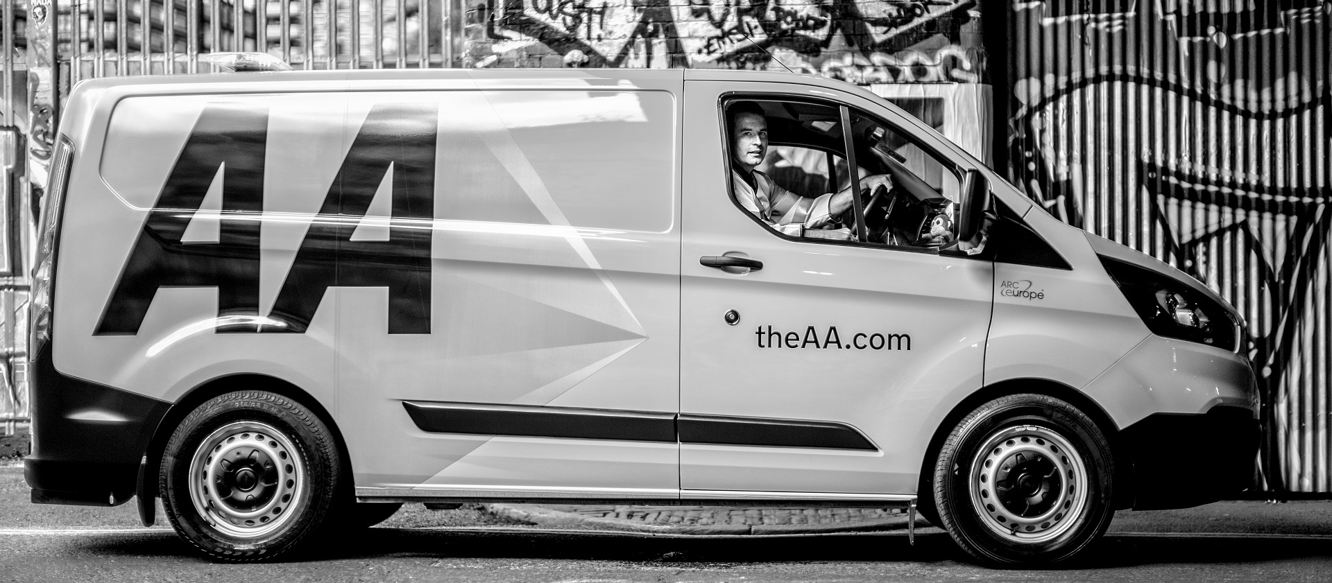 a man sitting on driving seat in van