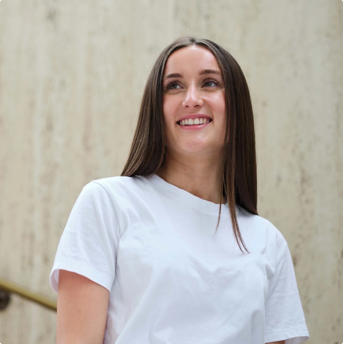 women in white top smiling
